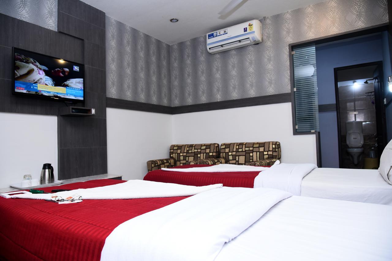 Grand Choice Hotel Bengaluru Szoba fotó