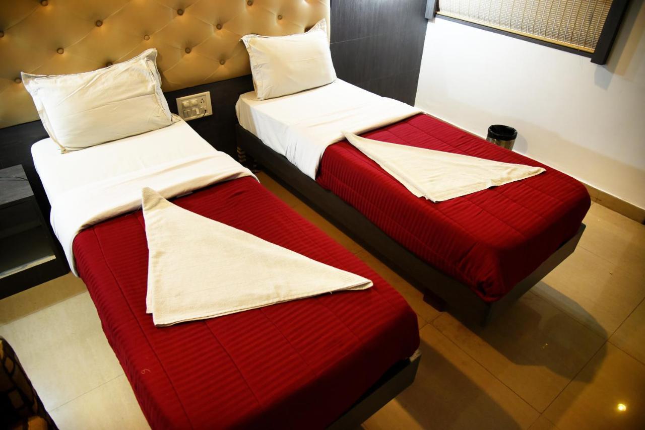 Grand Choice Hotel Bengaluru Szoba fotó